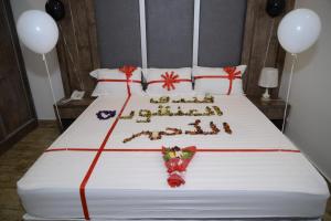 Postel nebo postele na pokoji v ubytování فندق سويت لافندر Lavender Suite Hotel
