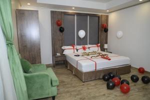 Postel nebo postele na pokoji v ubytování فندق سويت لافندر Lavender Suite Hotel