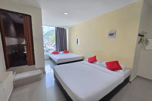 Postel nebo postele na pokoji v ubytování Hotel Inap Sri Gombak