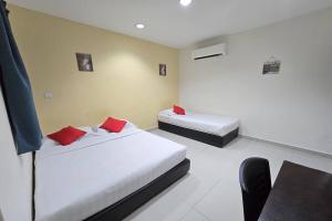 Postel nebo postele na pokoji v ubytování Hotel Inap Sri Gombak
