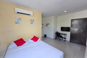Postel nebo postele na pokoji v ubytování Hotel Inap Sri Gombak