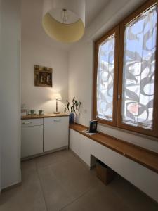 a kitchen with a large window and a table at Villa Ettore in Pompei