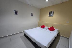 Postel nebo postele na pokoji v ubytování Hotel Inap Sri Gombak