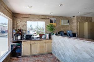 a bar in a kitchen with a counter top at Motel 6-Santa Fe, NM - Downtown in Santa Fe