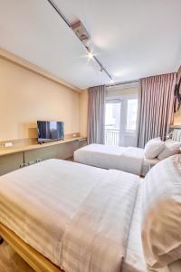 The Connor Serviced Residences Managed by HIIにあるベッド