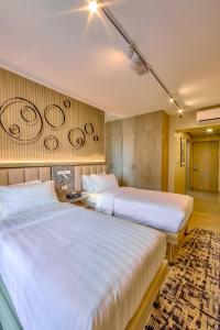 The Connor Serviced Residences Managed by HIIにあるベッド