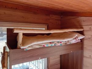 a wooden cabin with two bunk beds in it at CASA Petra in Bituše
