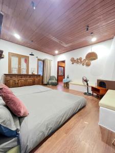 Postel nebo postele na pokoji v ubytování Quán Nhỏ Trên Đồi Homestay