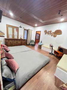 Postel nebo postele na pokoji v ubytování Quán Nhỏ Trên Đồi Homestay