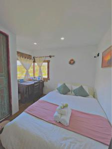 Postel nebo postele na pokoji v ubytování Quán Nhỏ Trên Đồi Homestay