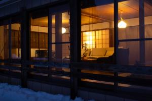 a view of a living room with a couch in a house at TEIEN stay sauna in Ōtani +74 photos