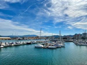 a bunch of boats are docked in a harbor at Rincón de María - Ganador Traveller Awards 2025 y 2026 in Playa de Gandia