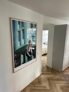 a television hanging on a wall in a room at STAYplaza in Kolding