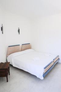 Giường trong phòng chung tại Chalet en la Playa con Piscina Privada - holaVivienda Inmobiliaria