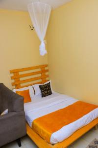 Ένα ή περισσότερα κρεβάτια σε δωμάτιο στο WINNIE'S BNBs Naivasha