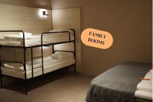 a room with two bunk beds with a sign saying family rooms at Citybox Stockholm in Stockholm