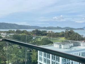 a view of the water from the balcony of a building at Riverson Soho Luxury Stay by Finest Homestay in Kota Kinabalu