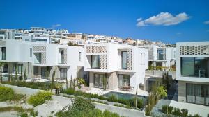 an architectural rendering of a white apartment building at Oasis Villa 3 in Khlorakas