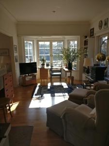 a living room with a couch and a table at Villa Markomby in Markomby