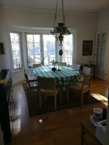 a dining room table and chairs in a kitchen at Villa Markomby in Markomby