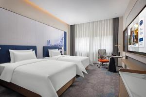 Letto o letti in una camera di Hampton by Hilton Nanjing Xianlin University Town