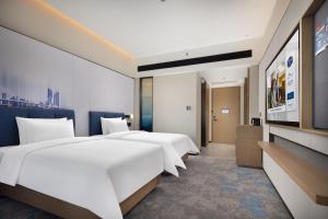 Letto o letti in una camera di Hampton by Hilton Nanjing Xianlin University Town
