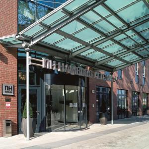 a entrance to a building with a glass ceiling at NH Hamburg Altona in Hamburg
