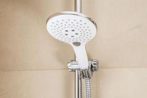 a shower with a shower head in a bathroom at NH Hamburg Altona in Hamburg