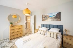 Posteľ alebo postele v izbe v ubytovaní Apartament Reymonta 15 SurfingBird Kołobrzeg