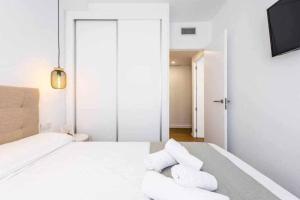 Łóżko lub łóżka w pokoju w obiekcie Precioso apartamento en el centro de Nerja