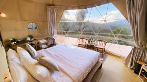 PHULAYYA CHIANGMAI - Luxury Dome客房内的一张或多张床位