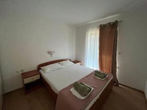 Posteľ alebo postele v izbe v ubytovaní Apartmani Eva