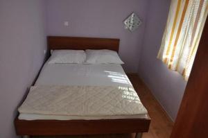 Posteľ alebo postele v izbe v ubytovaní Apartmani Eva
