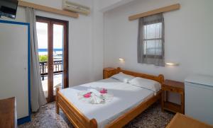 Postel nebo postele na pokoji v ubytování Minoa sea rooms