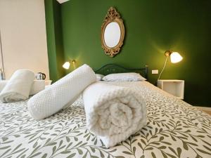 Postel nebo postele na pokoji v ubytování b&b il Melograno