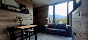 a room with a chair and a table and a window at Keller Apartment - DQ Tower in Sulz am Neckar