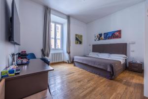 Postel nebo postele na pokoji v ubytování Rome Armony Suites