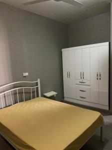 Postel nebo postele na pokoji v ubytování Casa Amarela