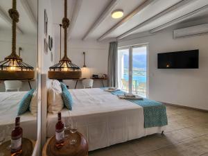 a bedroom with a bed with a view of the ocean at Blue Bay Lifestyle - ex Bali Blue Bay in Balíon +289 photos