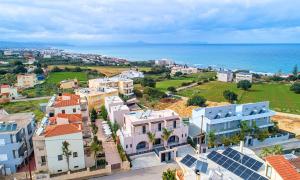 an aerial view of a town next to the ocean at Ferienhaus Für 28 Personen In Skaleta, Kreta Nordküste Kretas in Skaleta +29 photos