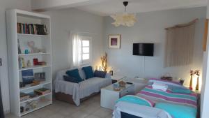 Posteľ alebo postele v izbe v ubytovaní Vintage Beach House