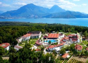 an aerial view of a resort with a lake and mountains at Lykia Botanika Beach Fun & Club - All Inclusive in Fethiye