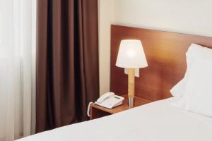 Posteľ alebo postele v izbe v ubytovaní Sercotel Arrahona Sabadell