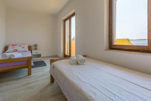 Postel nebo postele na pokoji v ubytování VILLA VISA
