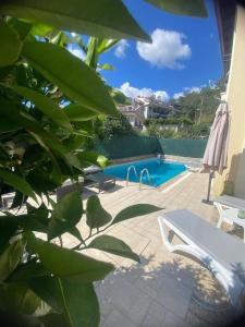 a swimming pool with a white bench next to at Villa Lavanta Marmaris Daily Weekly Rentals in Marmaris