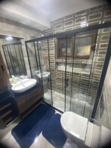 a bathroom with a white toilet and a sink at Villa Lavanta Marmaris Daily Weekly Rentals in Marmaris