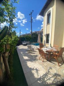 a patio with a table and chairs next to a house at Villa Lavanta Marmaris Daily Weekly Rentals in Marmaris +18 photos