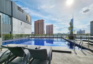 a swimming pool on the roof of a building at Skyview Bukit Bintang Fairlane Residence #24 in Kuala Lumpur