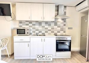 Kuchyň nebo kuchyňský kout v ubytování DOMuum Holidays - ANCORA Studio II + 10 fotografií