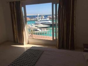 A bed or beds in a room at Marena Hurghada
